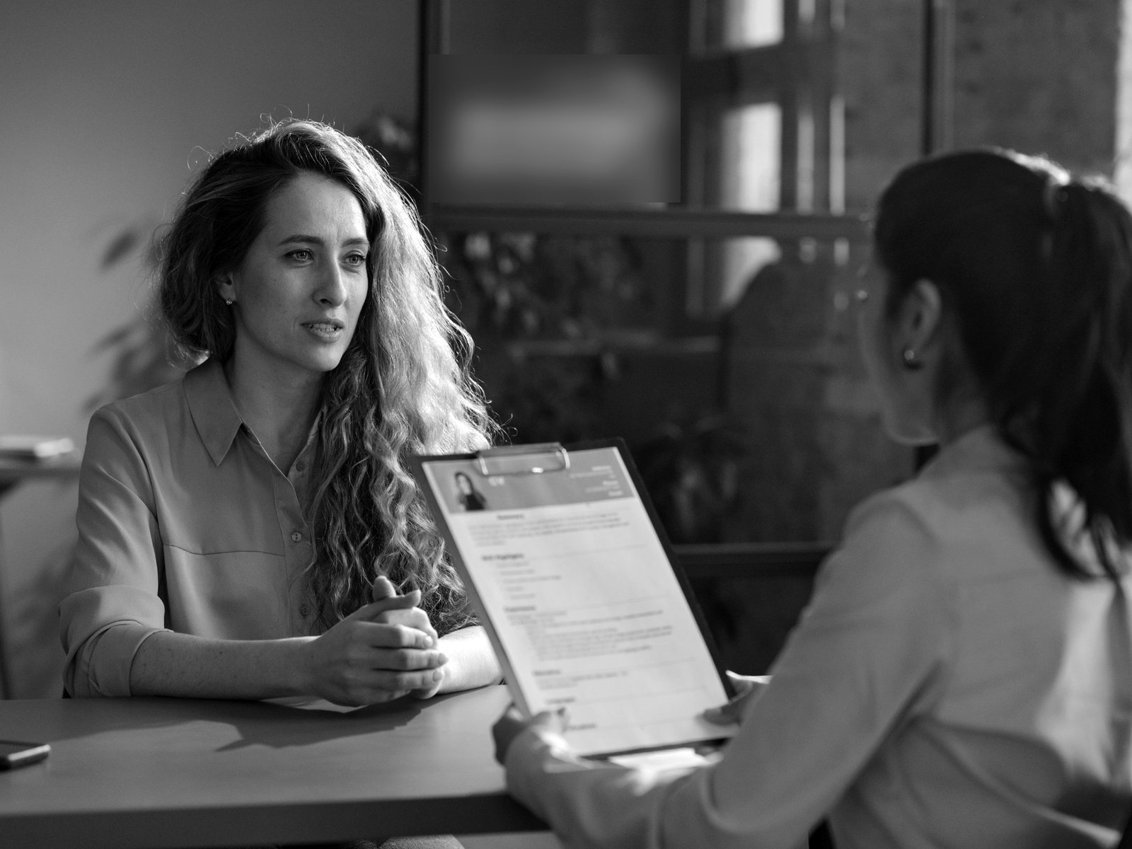 A candidate in conversation with a children's home director